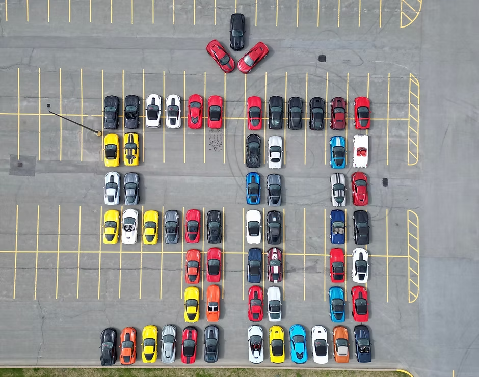 Aerial view of CCNS Corvettes parked in a C formation